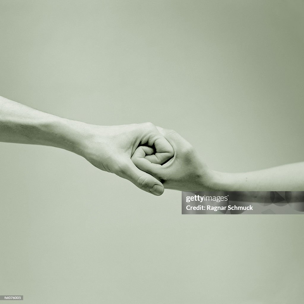 Interlocked Interlocked Hands High-Res Stock Photo - Getty Images