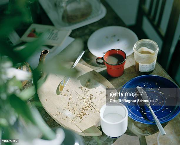 a messy breakfast table - super sensory stock pictures, royalty-free photos & images