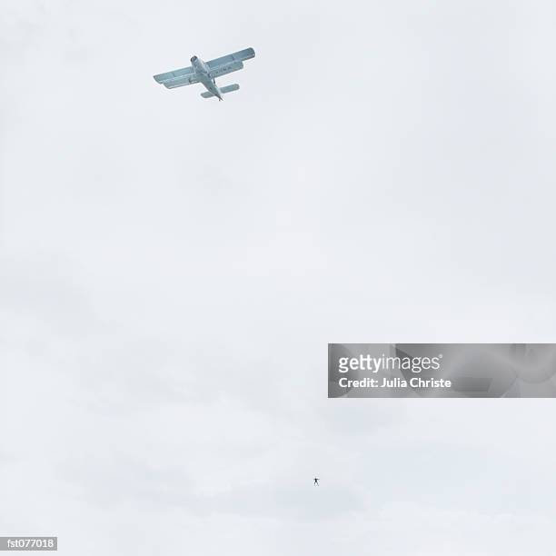 an airplane and skydiver - julia an stock pictures, royalty-free photos & images
