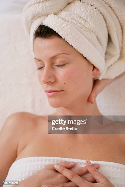 a massage therapist massaging a woman?s neck - stella stock pictures, royalty-free photos & images