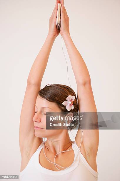 a woman stretching her arms - stella stock pictures, royalty-free photos & images