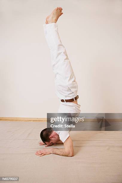 a man in a handstand - stella stock pictures, royalty-free photos & images