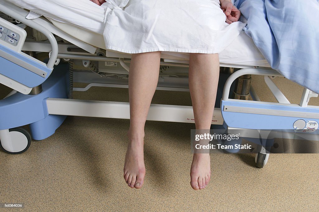 A patient sitting on a hospital bed