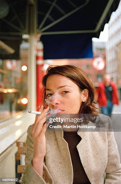 woman smoking a cigarette - anti smoking bildbanksfoton och bilder