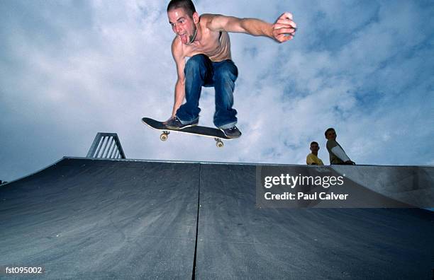 man on skateboard jumping in air - lexus cup of china 2014 isu grand prix of figure skating day 3 stockfoto's en -beelden
