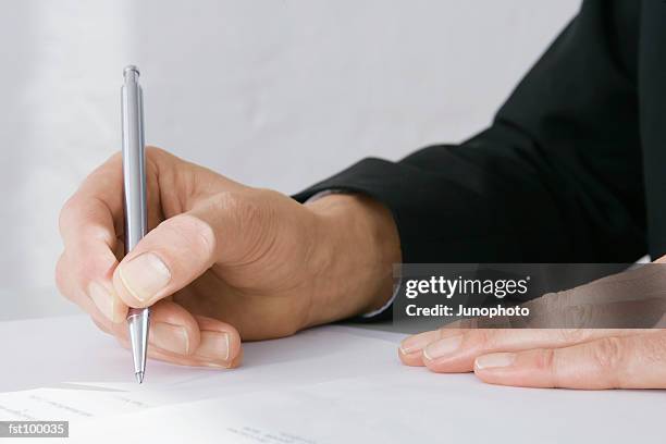 businessman holding a pen - ballpoint pen 個照片及圖片檔