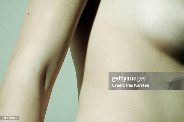 close-up of woman?s arm and torso - hinge joint stock pictures, royalty-free photos & images