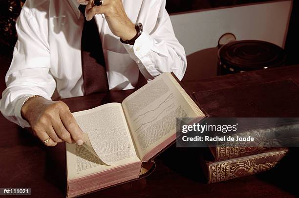 man reading a book - rache stock pictures, royalty-free photos & images