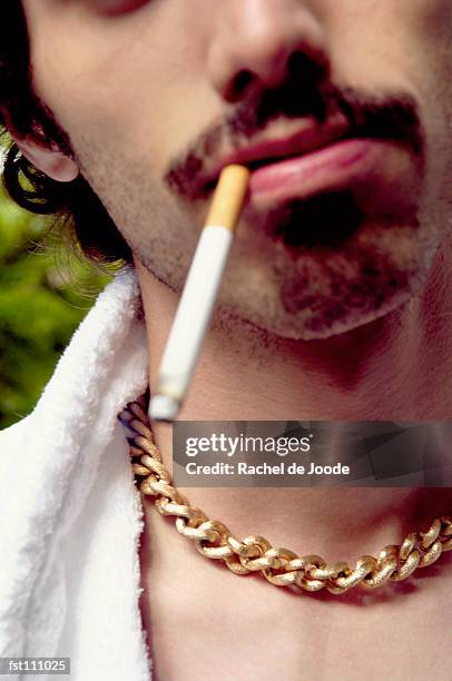 man smoking a cigarette - rache stock pictures, royalty-free photos & images