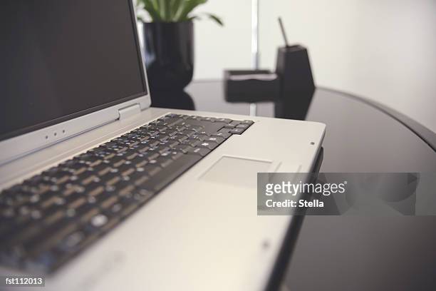 laptop computer on office table - stella stock pictures, royalty-free photos & images