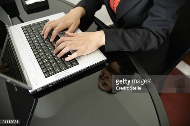 woman using laptop computer - stella stock-fotos und bilder