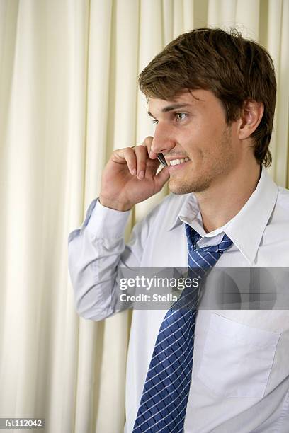 man using cell phone - stella stock pictures, royalty-free photos & images