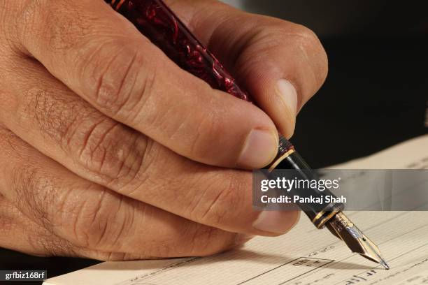 Man Write Check Man Writing A Check Photos and Premium High Res Pictures - Getty Images