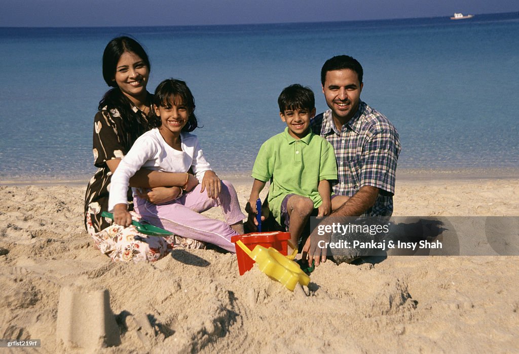 Family of four on the beach