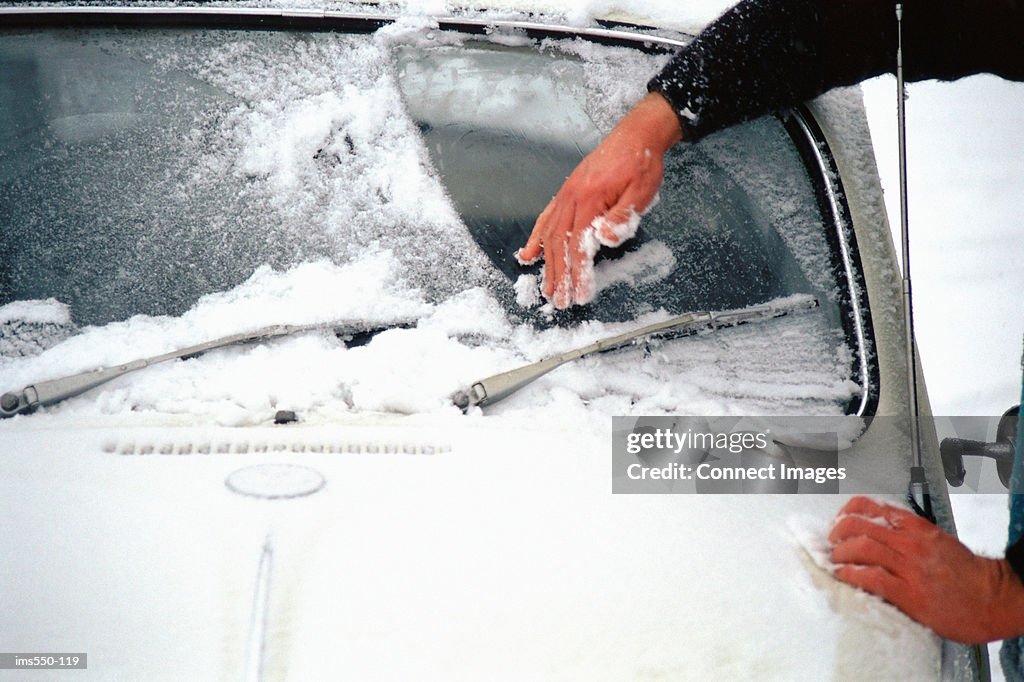 Scraping ice off car window