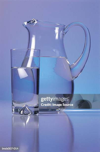 glass and jug - carafe stock pictures, royalty-free photos & images