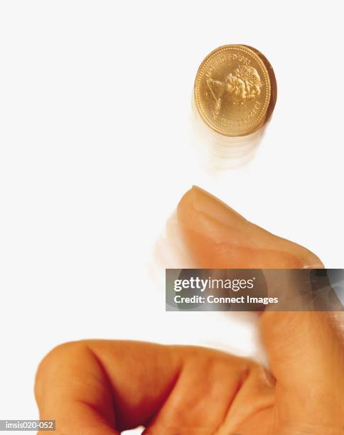hand tossing coin - throwing stock pictures, royalty-free photos & images
