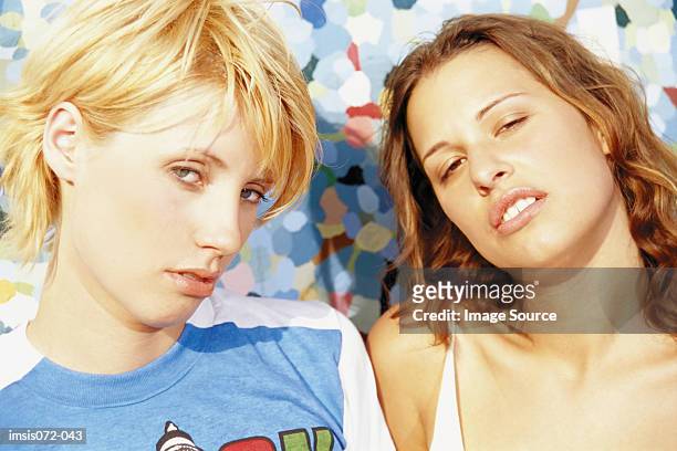 two girls - sneering stock pictures, royalty-free photos & images