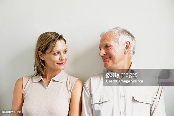 man and woman - father and grown up daughter stock-fotos und bilder