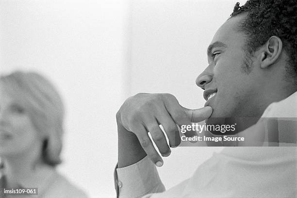 businessman and businesswoman in office - black and white office stock pictures, royalty-free photos & images