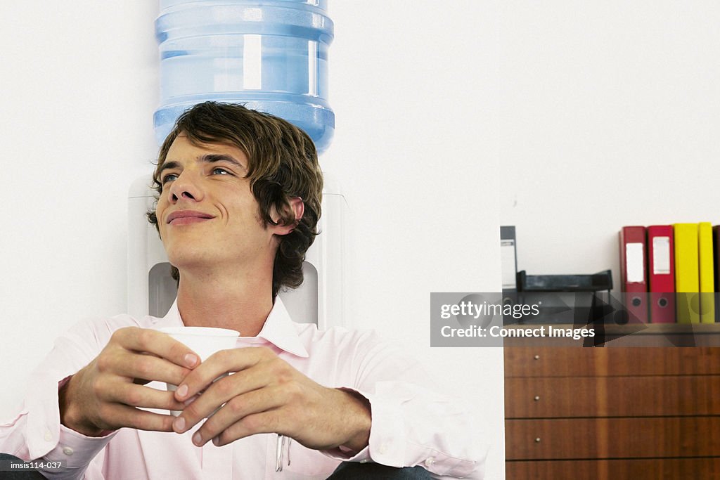 Businessman sitting next to mineral water