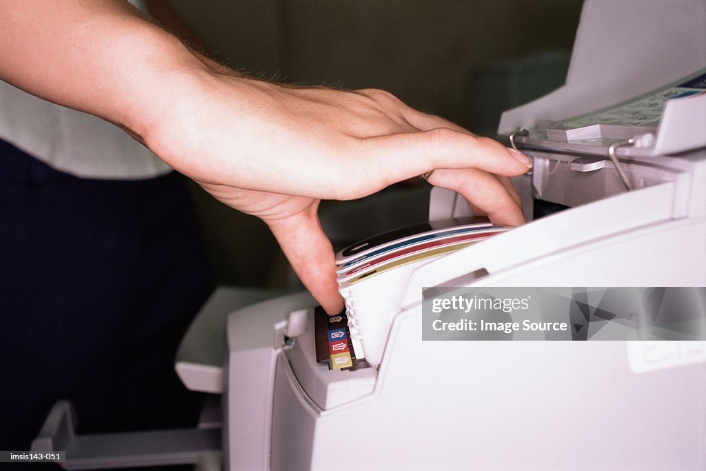 Woman fits colour cartridge