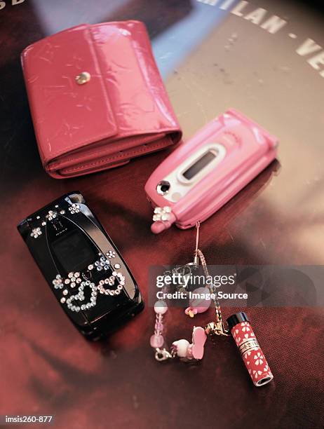 cellular telephone and purse - keyring charm stock pictures, royalty-free photos & images