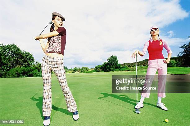 women playing golf - women golf ストックフォトと画像