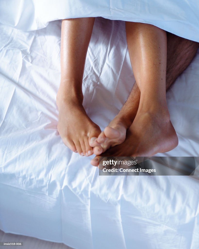 A young couple in bed