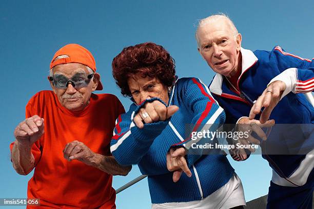 three elderly people posing as youth - hands in her pants fotografías e imágenes de stock