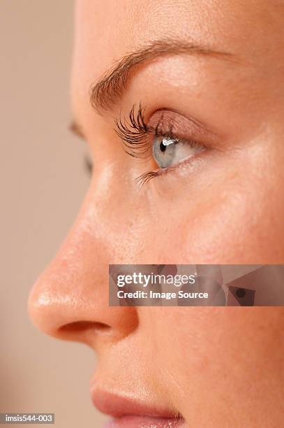 partial profile of female face - eyelash stock pictures, royalty-free photos & images