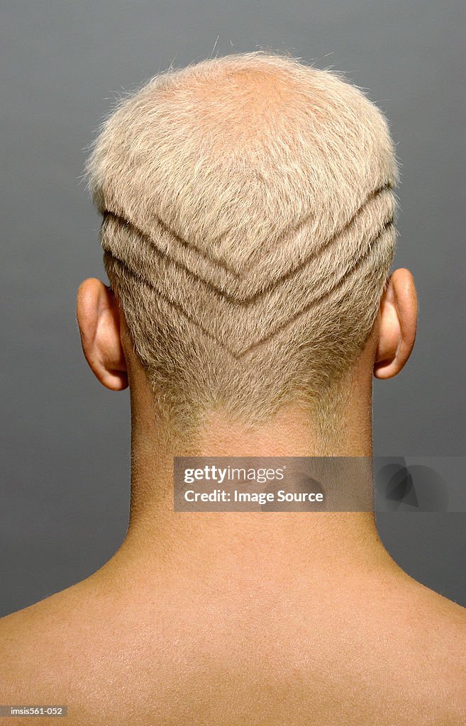 Man with lines shaved in hair