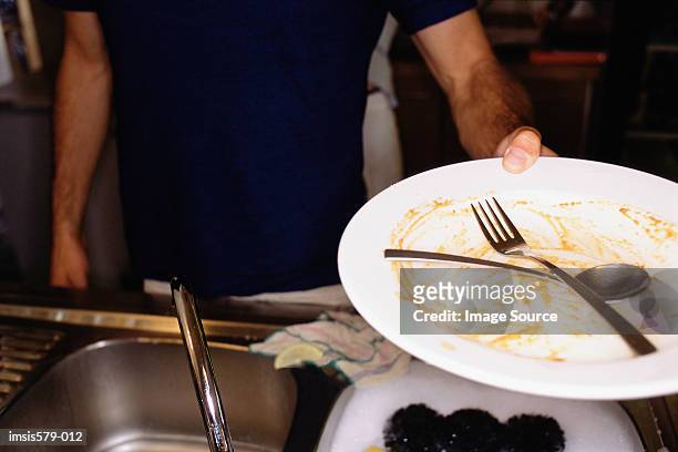 used plate and cutlery to wash - dirty sink stock pictures, royalty-free photos & images