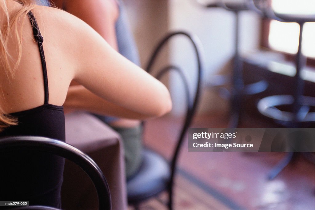 Two young women in cafe