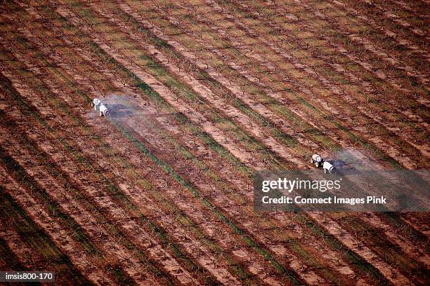 tractors on arable farm - hickory smoke stock pictures, royalty-free photos & images