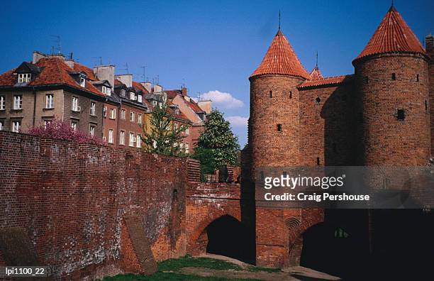 brick parapets and walls of barbican, medieval fort, low angle view, warsaw, poland - mazowieckie province stock pictures, royalty-free photos & images