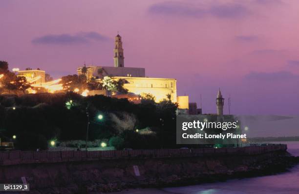 Sunset Behind Coastal Town Of Jaffa Low Angle View Tel Aviv Israel High-Res Stock Photo