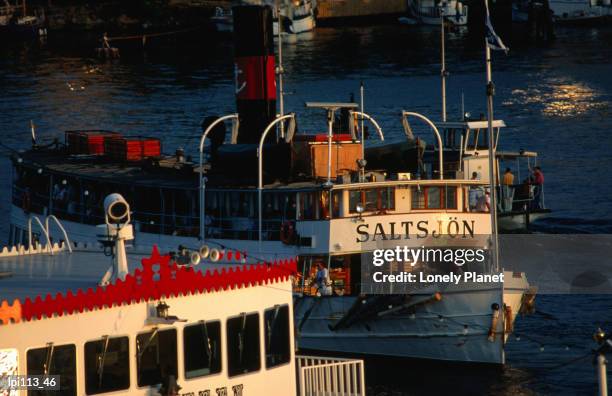 tour boats in harbour. - stockholm county stock pictures, royalty-free photos & images