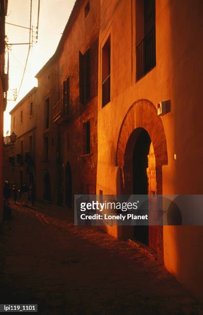 facade of dalt vila, old walled town. - vila stock pictures, royalty-free photos & images
