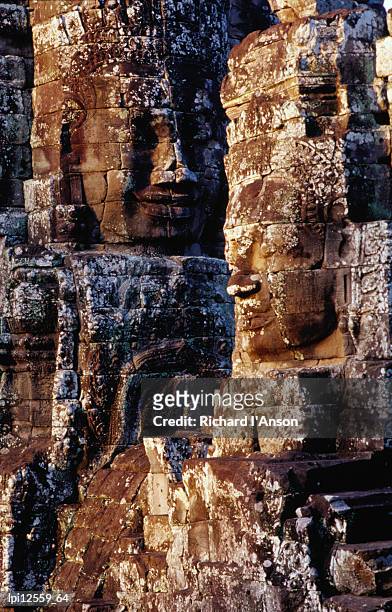 stone carvings of face of avalokiteshvara decorating towers of the bayon, angkor, siem reap, cambodia, south-east asia - guanyin bodhisattva stock-fotos und bilder