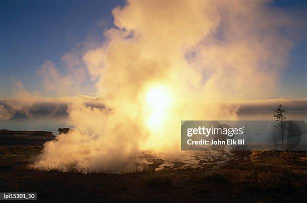 hot spring at sunrise in west thumb geyser basin, low angle view, yellowstone national park, united states of america - basin ストックフォトと画像