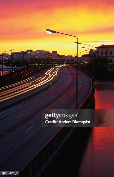 centralbron and sunset, stockholm, sweden - stockholm county stock pictures, royalty-free photos & images