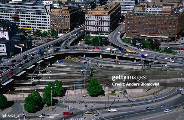 traffic and train junction at stockholm centralbron, stockholm, sweden - stockholm county stock pictures, royalty-free photos & images