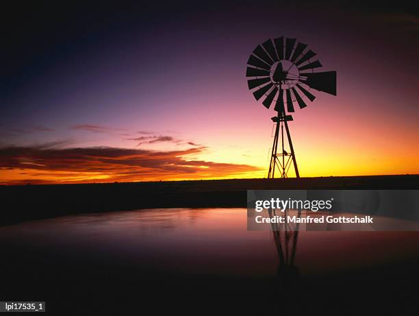 sunset over peninsula valdes, peninsula valdes, argentina - 工業用風車 ストックフォトと画像