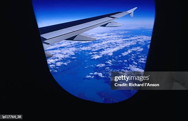 aircraft wing and clouds over southern patagonia, chile - região magallanes y antártica chilena imagens e fotografias de stock