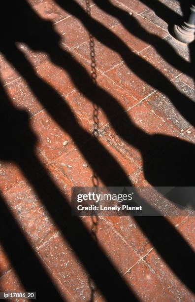 shadows of columns at cloister of basilica di san giovanni in laterano, rome, italy - san giovanni in laterano - fotografias e filmes do acervo