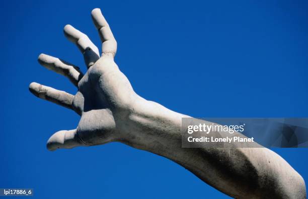 hand on statue on fontana dei quattro fiumi by bernini, piazza navona, rome, italy - fountain of the four rivers stock pictures, royalty-free photos & images