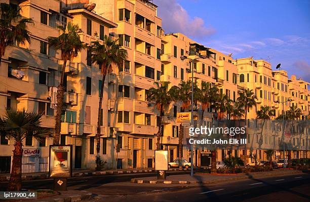 apartment buildings along el corniche, alexandria, egypt - alexandria egypt stock pictures, royalty-free photos & images