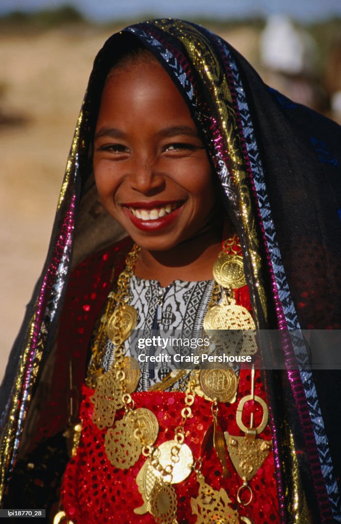 Girl in traditional dress at Sahara Festival, Looking at Camera, Front view, Douz, Tunisia