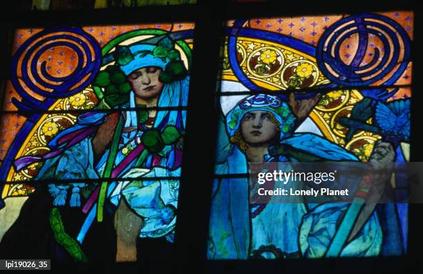 stained-glass windows with art nouveau mucha designs in st vitus cathedral, low angle view, prague, czech republic - nouveau stock pictures, royalty-free photos & images